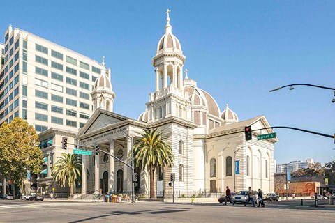 a church on the corner of a city street