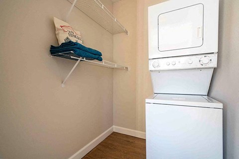a white washer and dryer in a laundry room with a white dryer