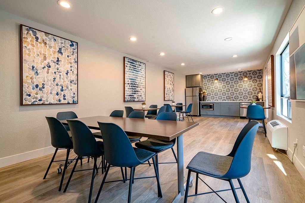 a conference room with a table and chairs