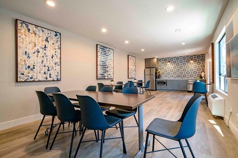 a conference room with a table and chairs