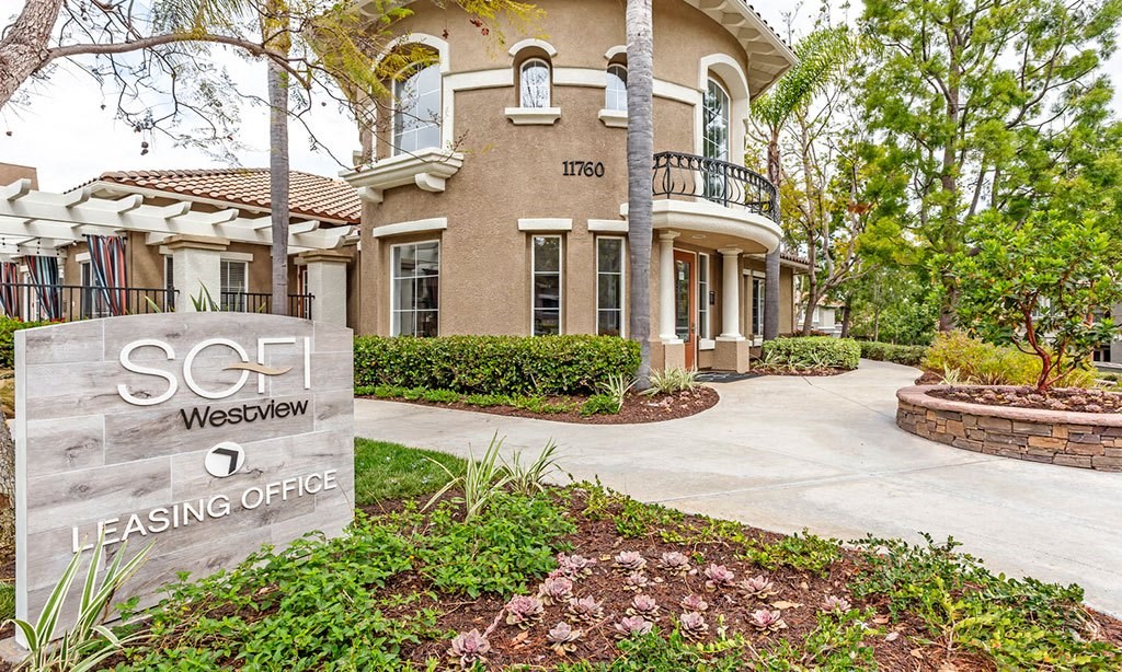 a house with a sign in front of it
