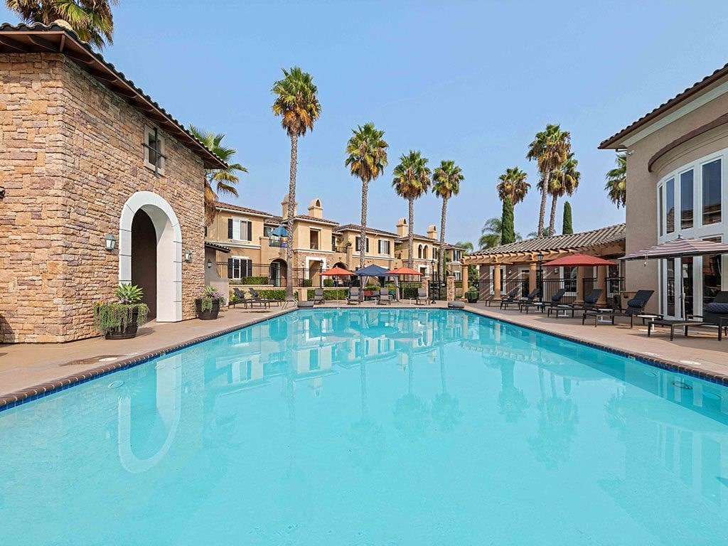 the swimming pool at the resort on a sunny day