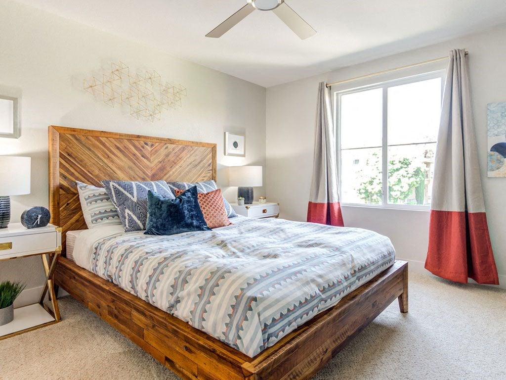 Bedroom with large window and ceiling fan Bedroom with large window and ceiling fan