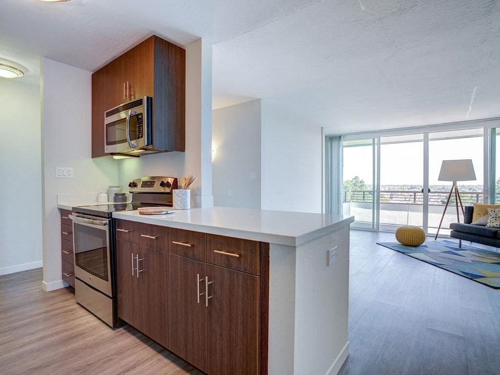 a kitchen with a stove and a microwave