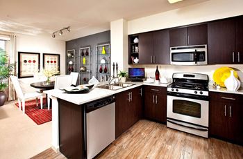 Ash or bamboo wood-looking flooring in kitchen and baths