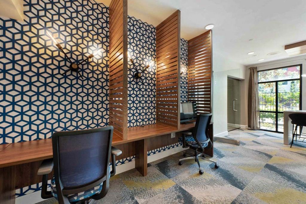 a conference room with two desks and a chair