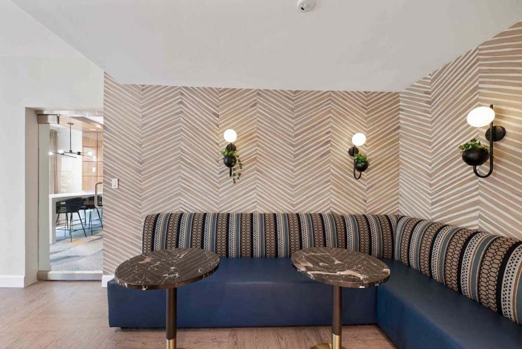 a living room with a couch and two tables