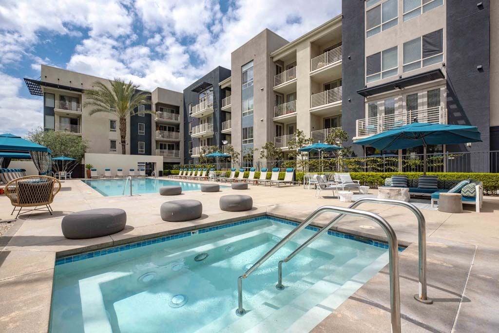 a swimming pool with a building in the background