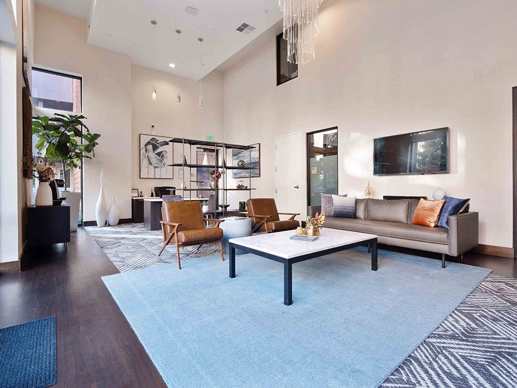 a living room with a couch and a table