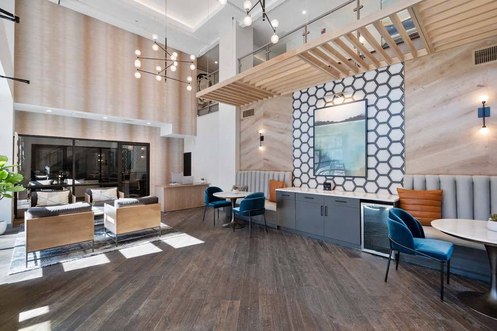 a living room with a fireplace and a table and chairs