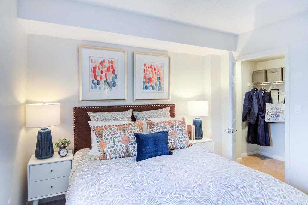 a bedroom with a bed and a closet