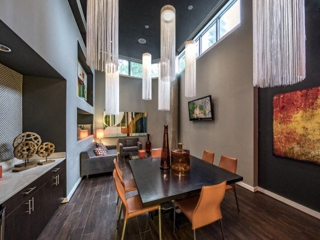 a dining room with a table and chairs