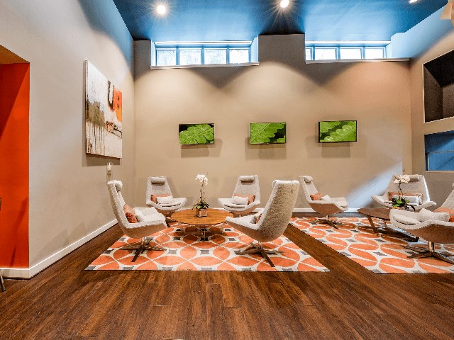 a meeting room with chairs and a round table