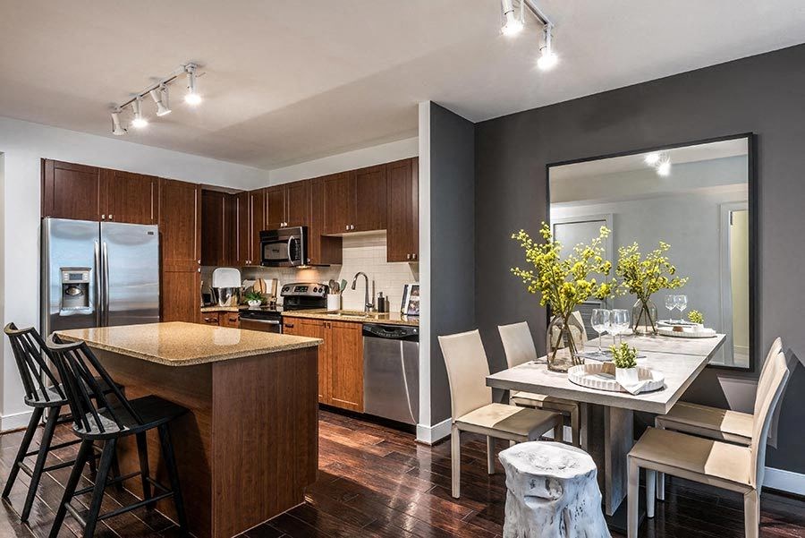 a kitchen and dining room with a table and chairs