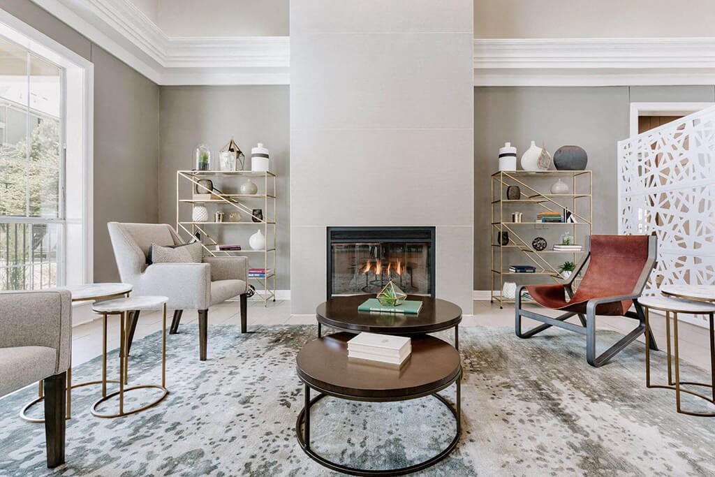 a living room filled with furniture and a fireplace