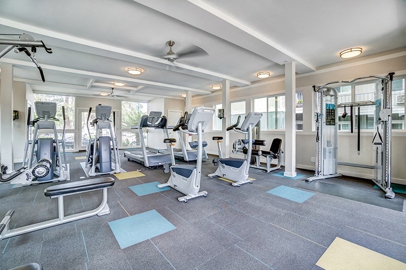 a gym with treadmills and other exercise equipment at the enclave at woodbury