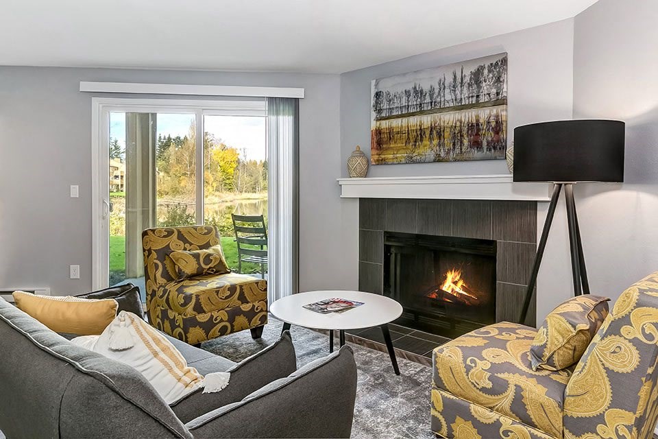 Living room with fireplace l Sofi Lakeside Apartments For Rent in Everett WA