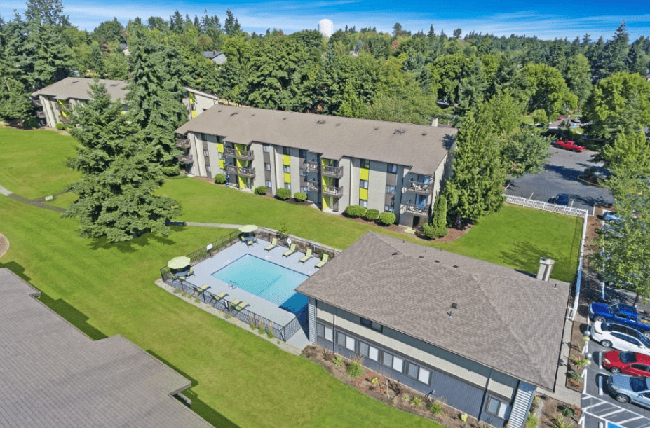 an aerial view of a house with a swimming pool