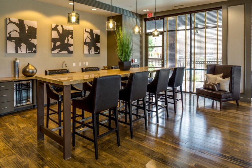 a dining room with a long table and chairs