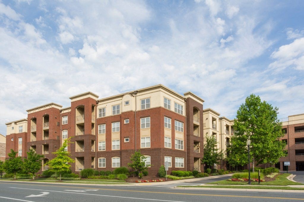 an apartment building on the corner of a street