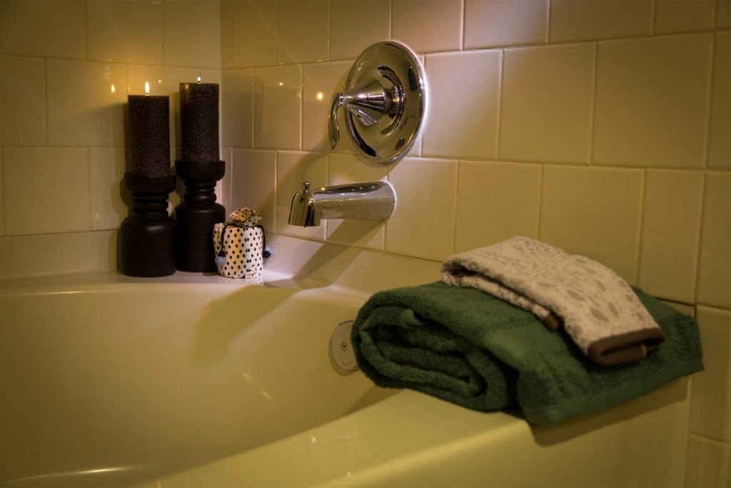 a towel on the edge of a bathroom sink