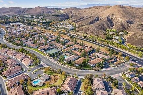 A residential area with houses and a pool.