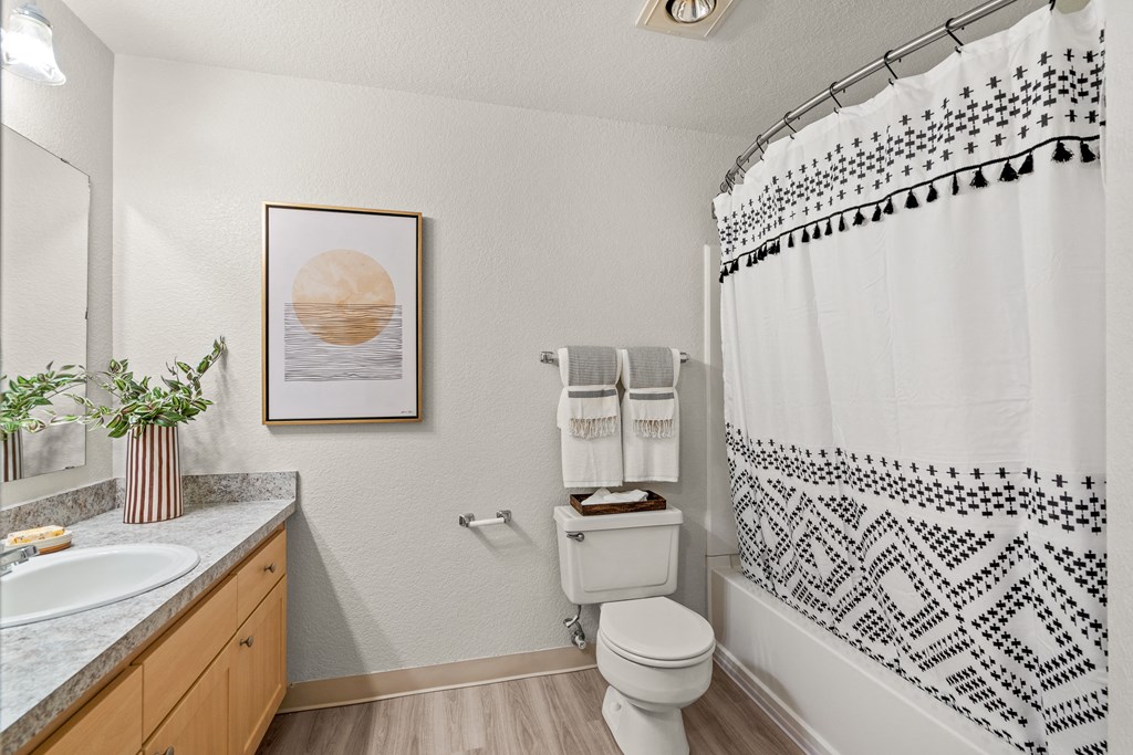 a bathroom with a toilet sink and bathtub
