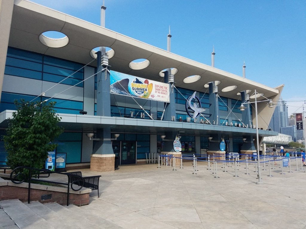 A large building with a blue and white sign that reads "Sulphur Springs".