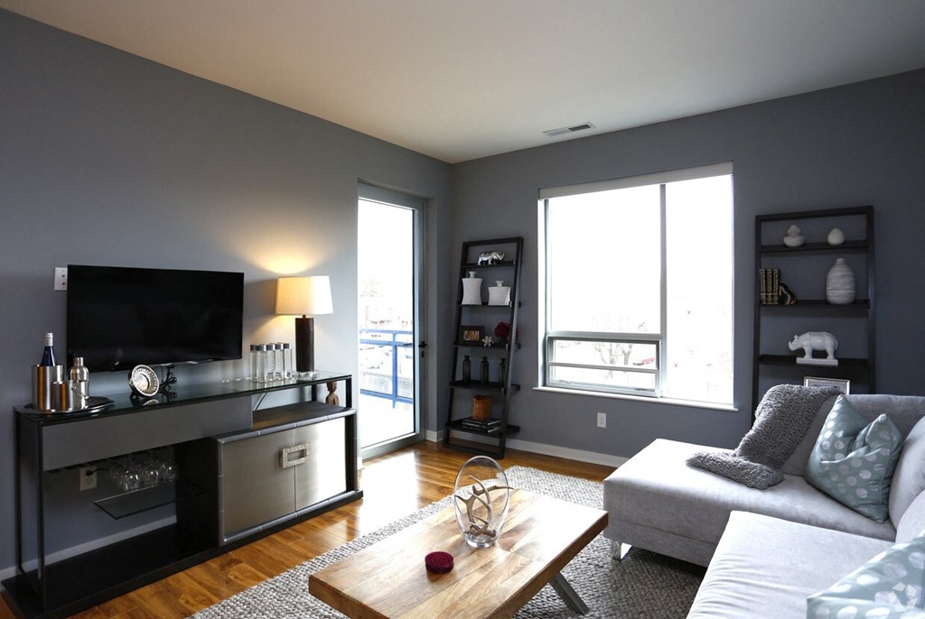 a living room with a couch and a tv