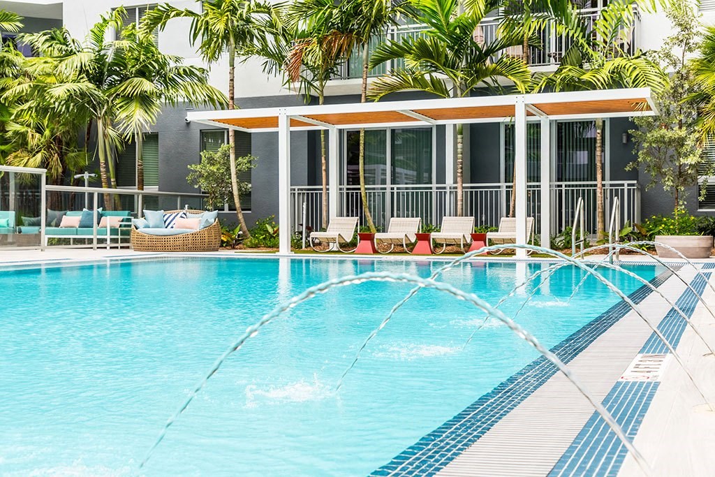 Pool With Lounge Area at Morea Apartments, Pompano Beach