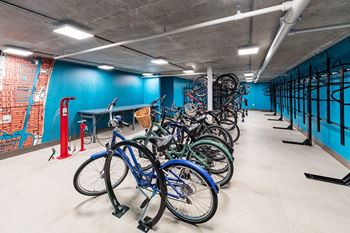 A bike parking area with blue bikes. at Morea Apartments, Pompano Beach, 33062