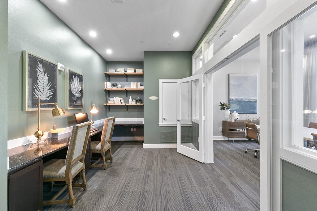 a dining room with a table and chairs and a window