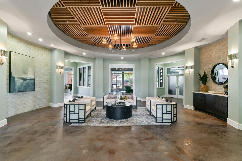 a living room with couches and a round table