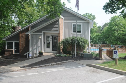 A small building with a flag on top of a pole.