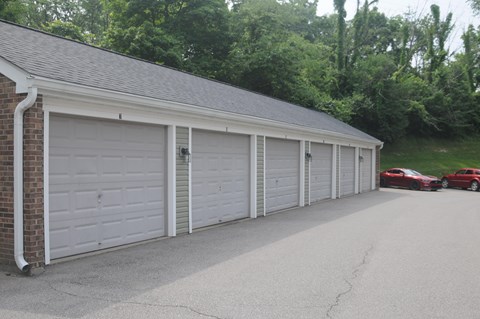 A row of white garage doors are closed.