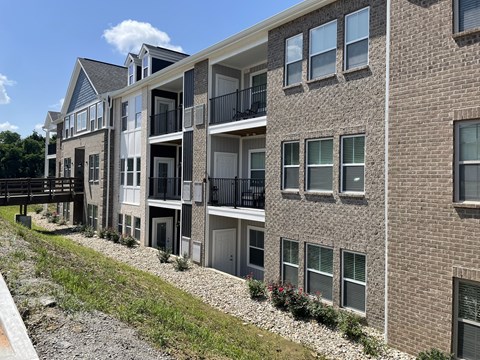 A multi-story apartment building with balconies and windows at Hamlet On The Bend, Hebrun, KY, 41048