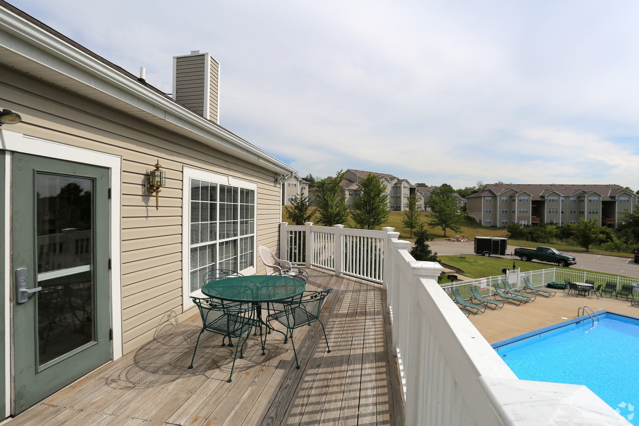 A house with a deck and a pool.