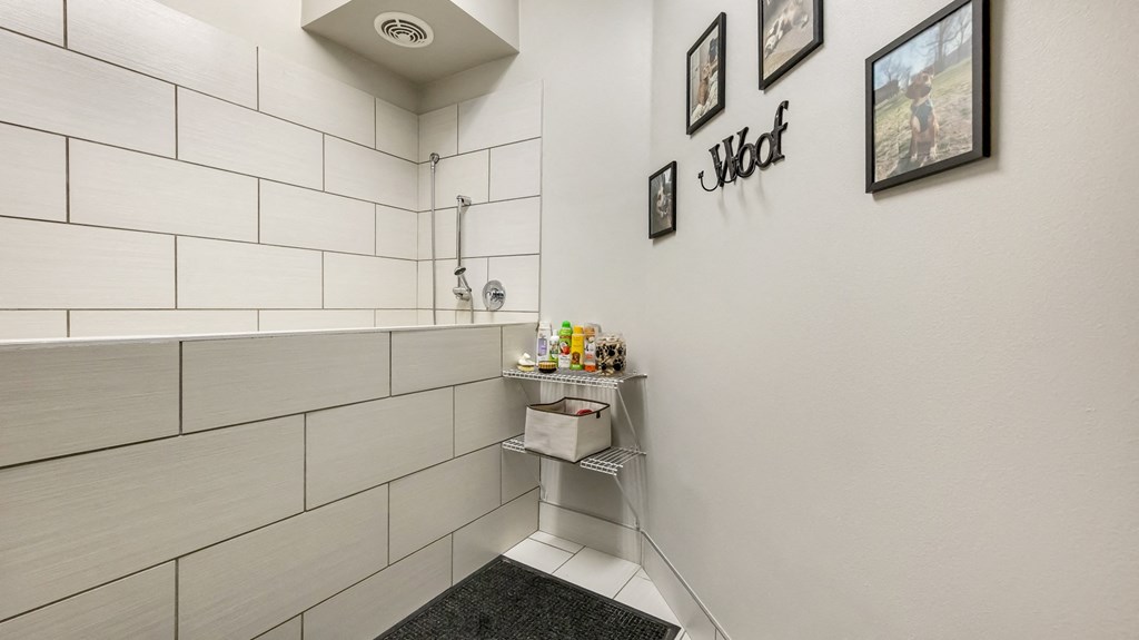 a bathroom with a shower and a sink in it at Vanguard Crossing, St. Louis