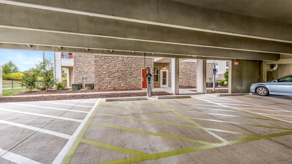 a parking lot with a car parked in front of a building at Vanguard Crossing, St. Louis, MO