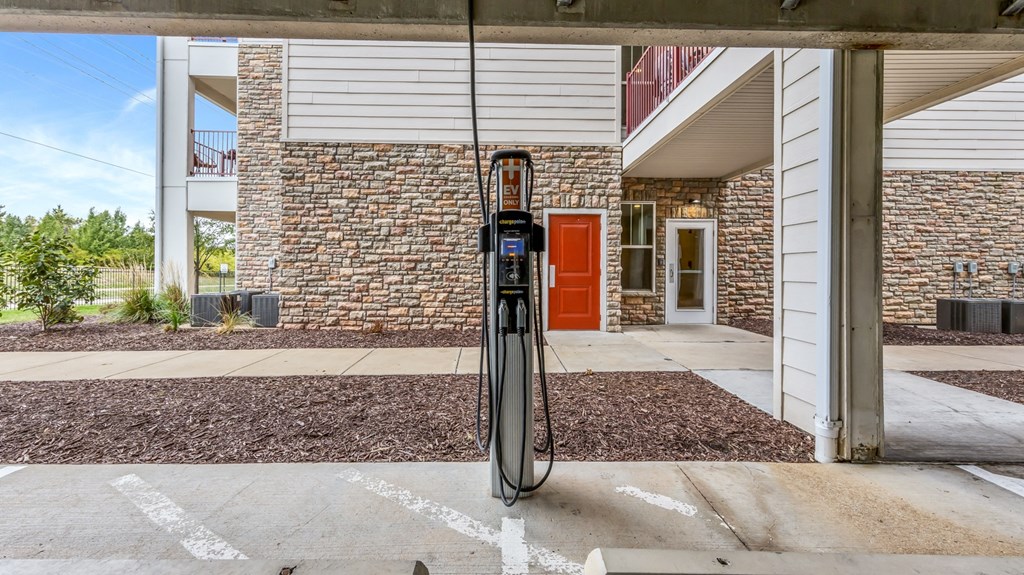 a gas pump at a gas station in front of a building at Vanguard Crossing, Missouri