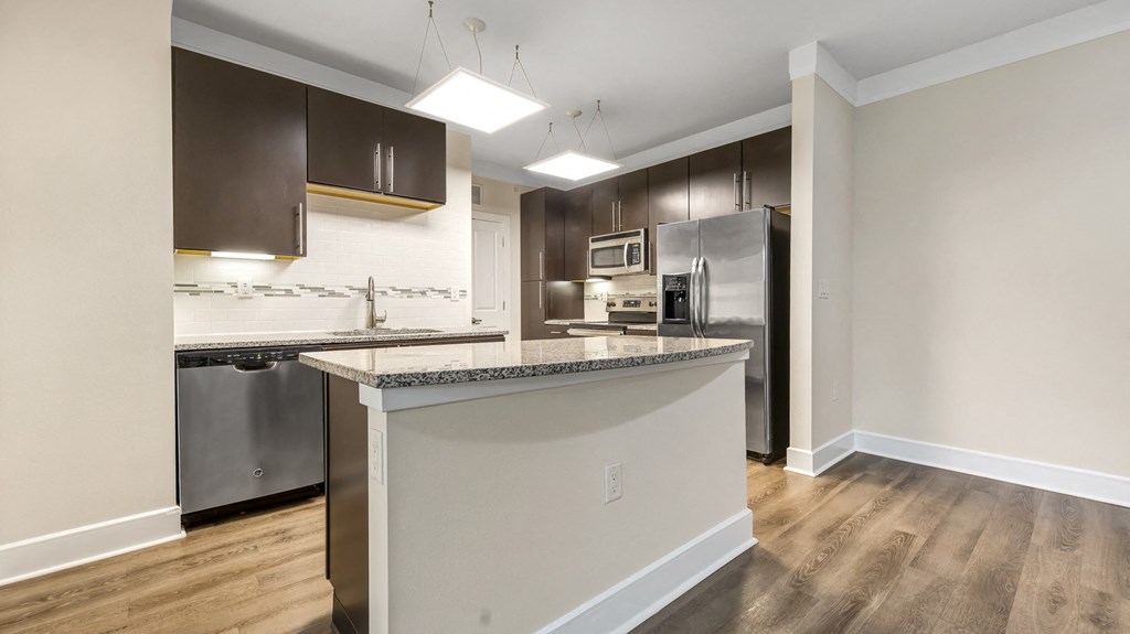 a kitchen with an island in the middle of it at Vanguard Crossing, St. Louis, Missouri