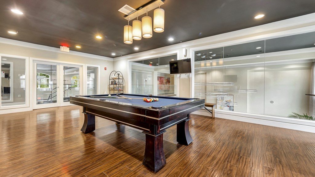 a game room with a pool table and a tv at Vanguard Crossing, St. Louis, MO 63124
