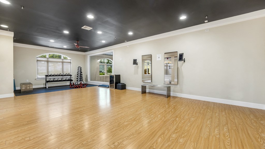 the multipurpose room has a hardwood floor at Vanguard Crossing, St. Louis, MO 63124