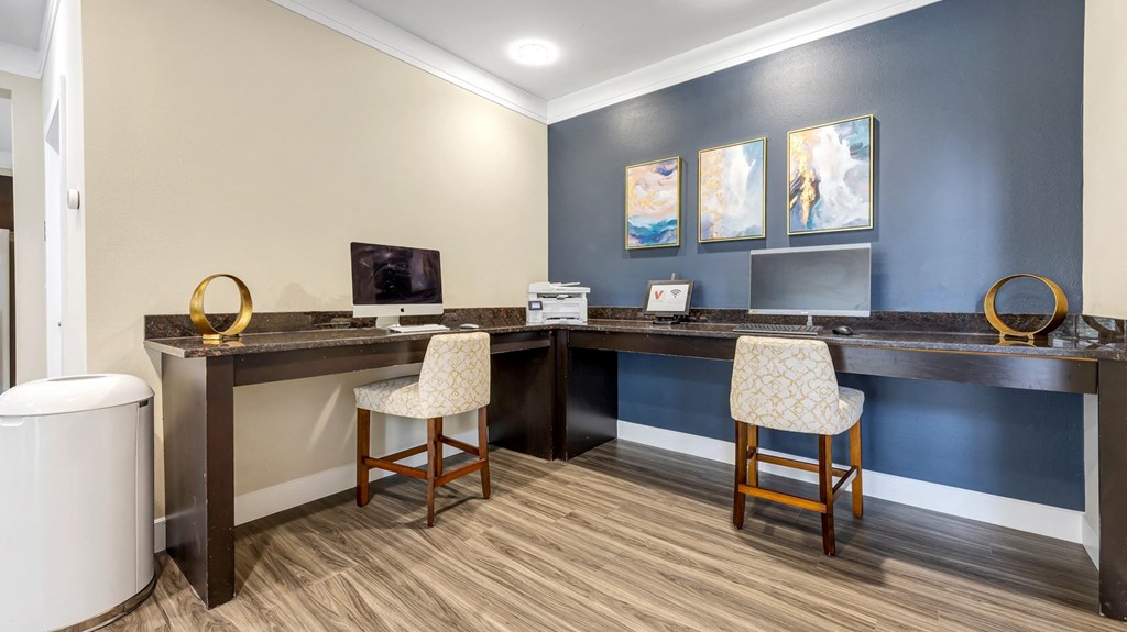 a office with two chairs and a desk with a computer at Vanguard Crossing, St. Louis, 63124