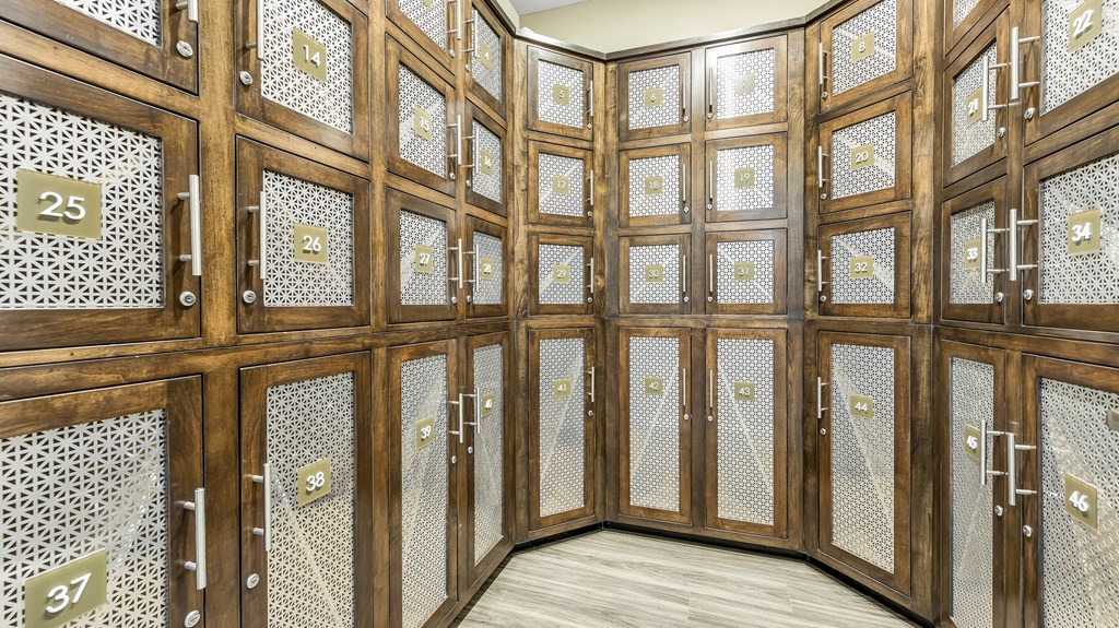 a room filled with wooden cabinets and lockers at Vanguard Crossing, St. Louis, MO 63124