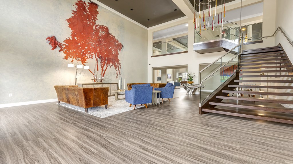 the lobby of a building with a lobby area and stairs at Vanguard Crossing, St. Louis, MO