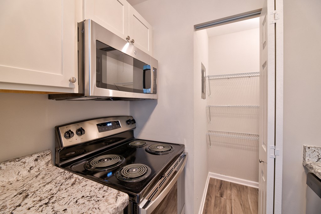 Electric Range In Kitchen at Glen Hills Apartments, Glendale, WI