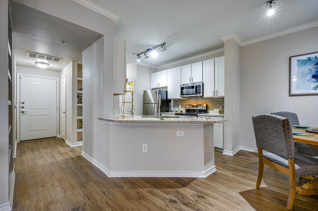 Kitchen And Dining Area at Riachi at One21, Texas