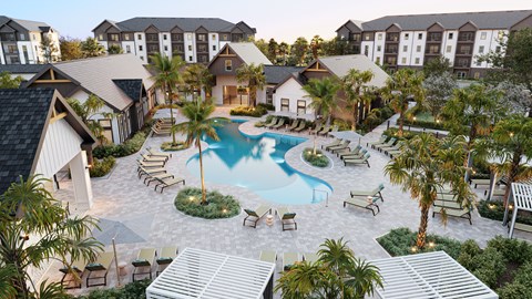 A resort with a swimming pool surrounded by palm trees.