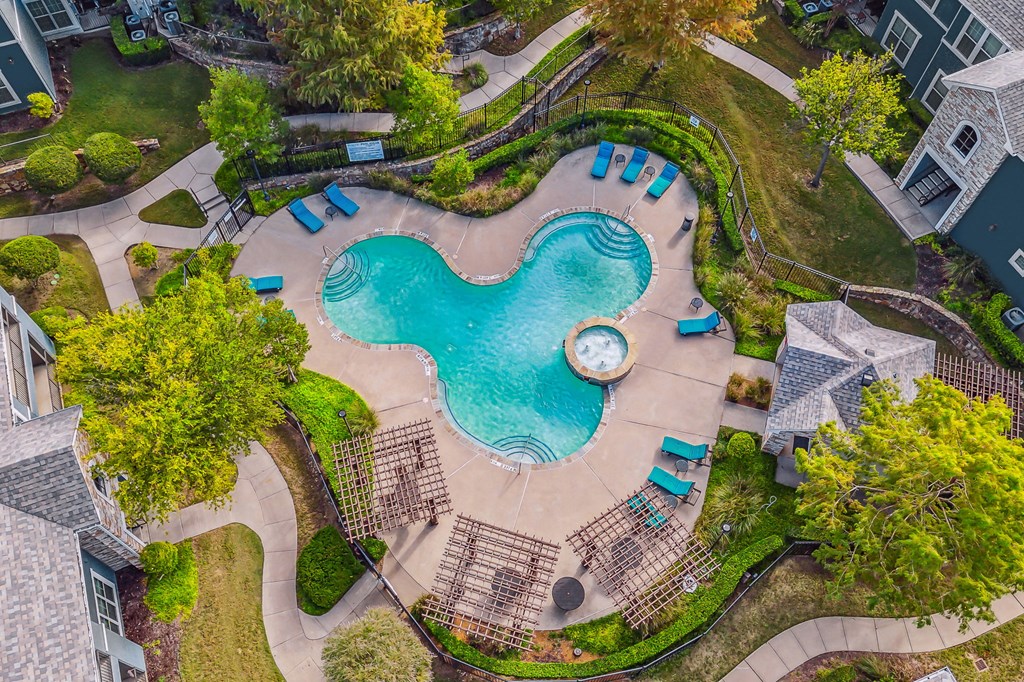 an overhead view of a swimming pool and a resort style pool